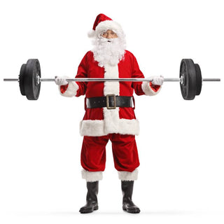 A man in a Santa suit lifts a barbell with change plates near Lexington, Kentucky (KY)